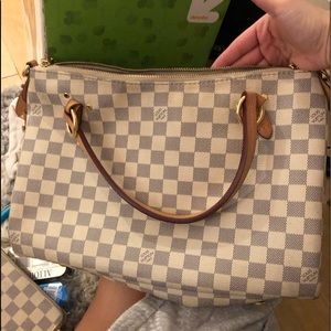 Louis Vuitton AUTHENTIC Lymington purse